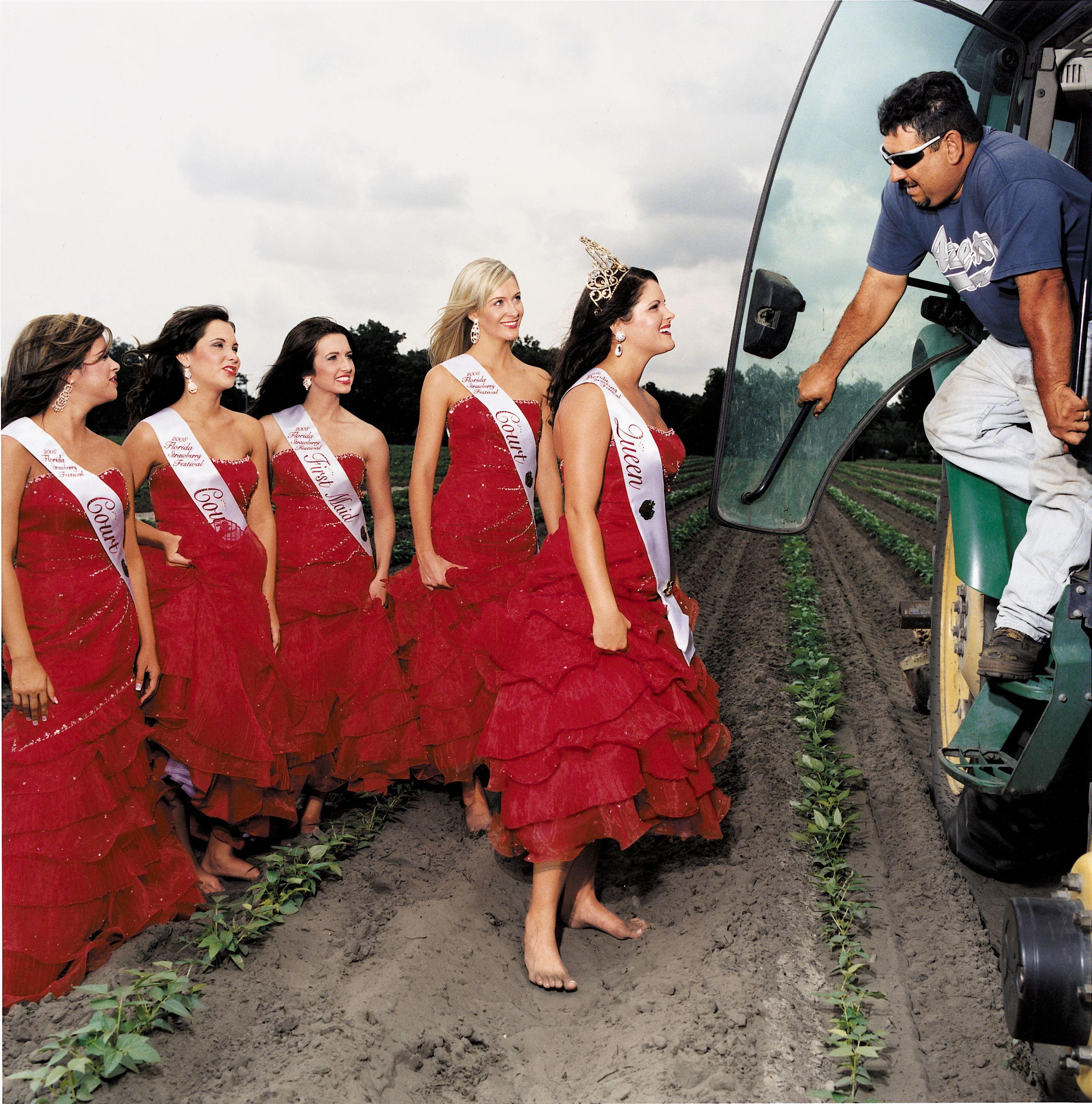 women in various outfits at a strawberry festival