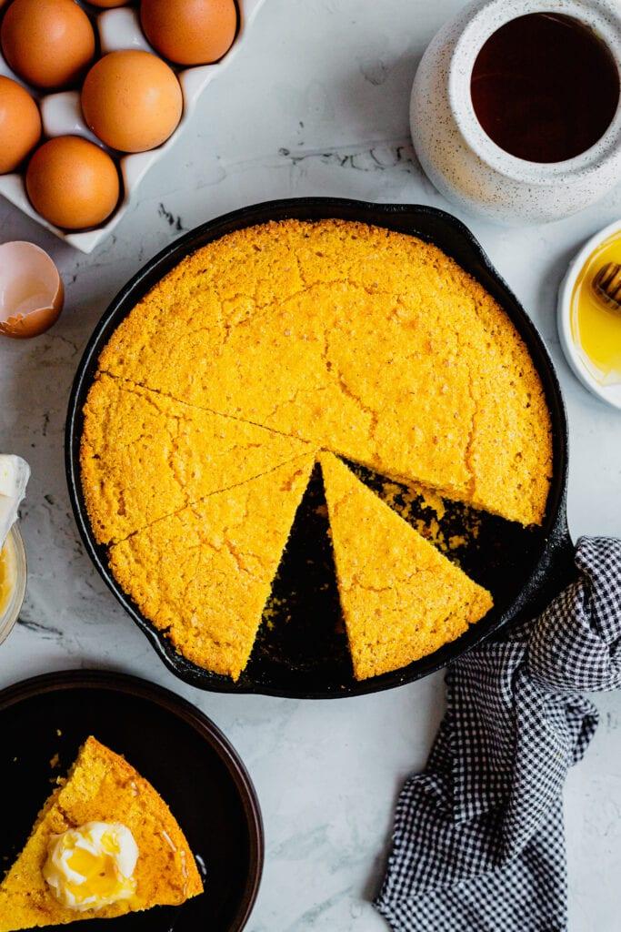 vintage cast iron skillet with freshly baked cornbread
