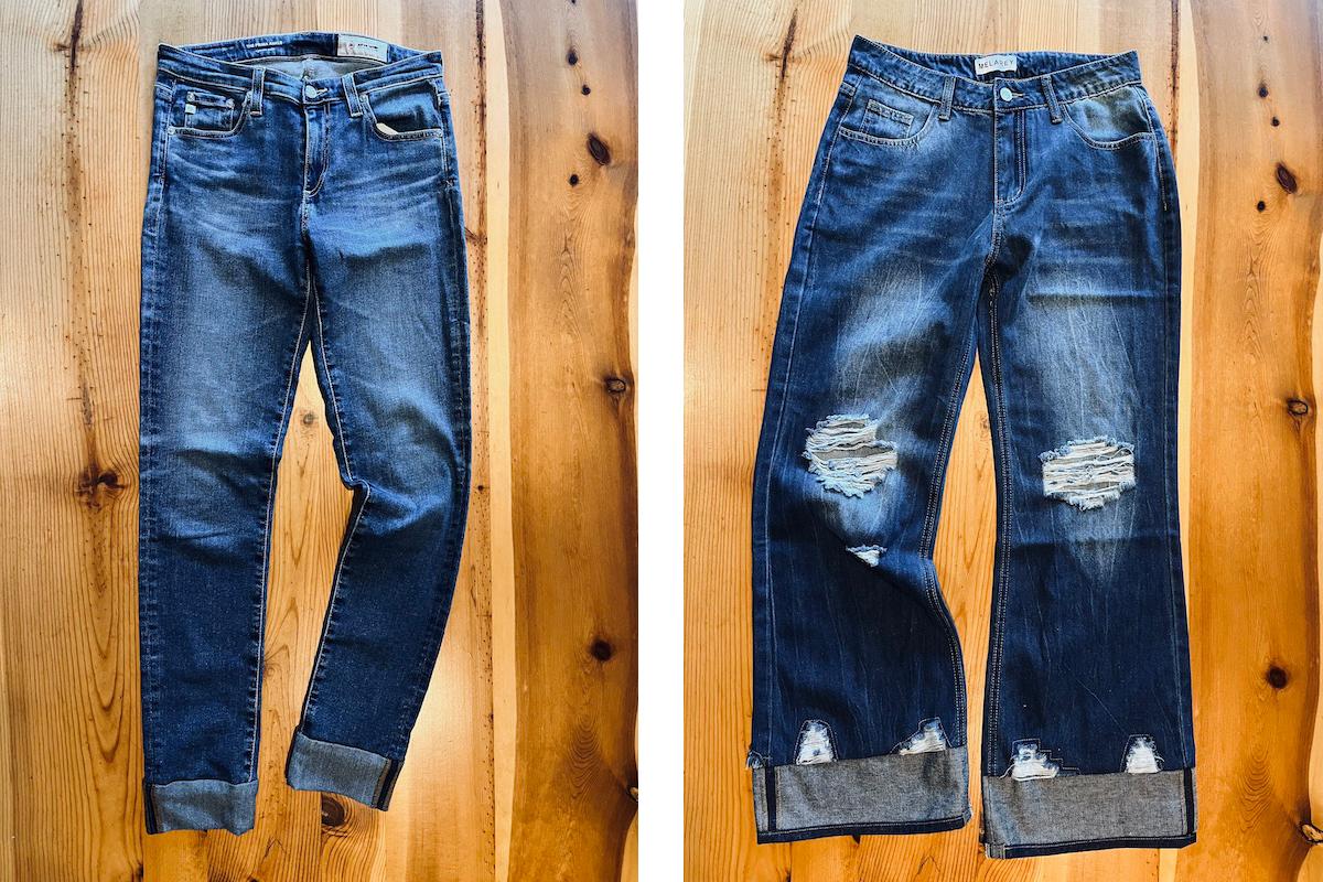 five different pairs of jeans for back to school laid out on a wooden surface