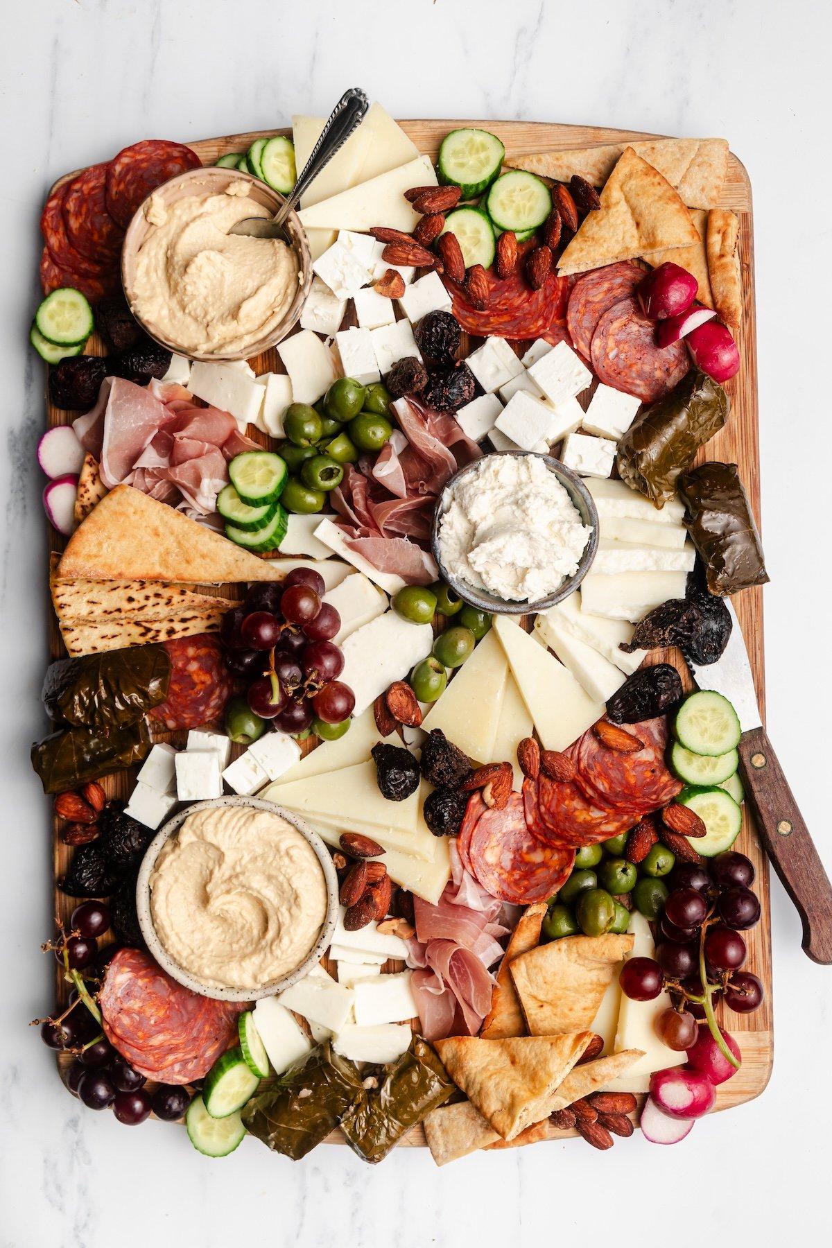 close up of various cheeses on a mediterranean charcuterie board