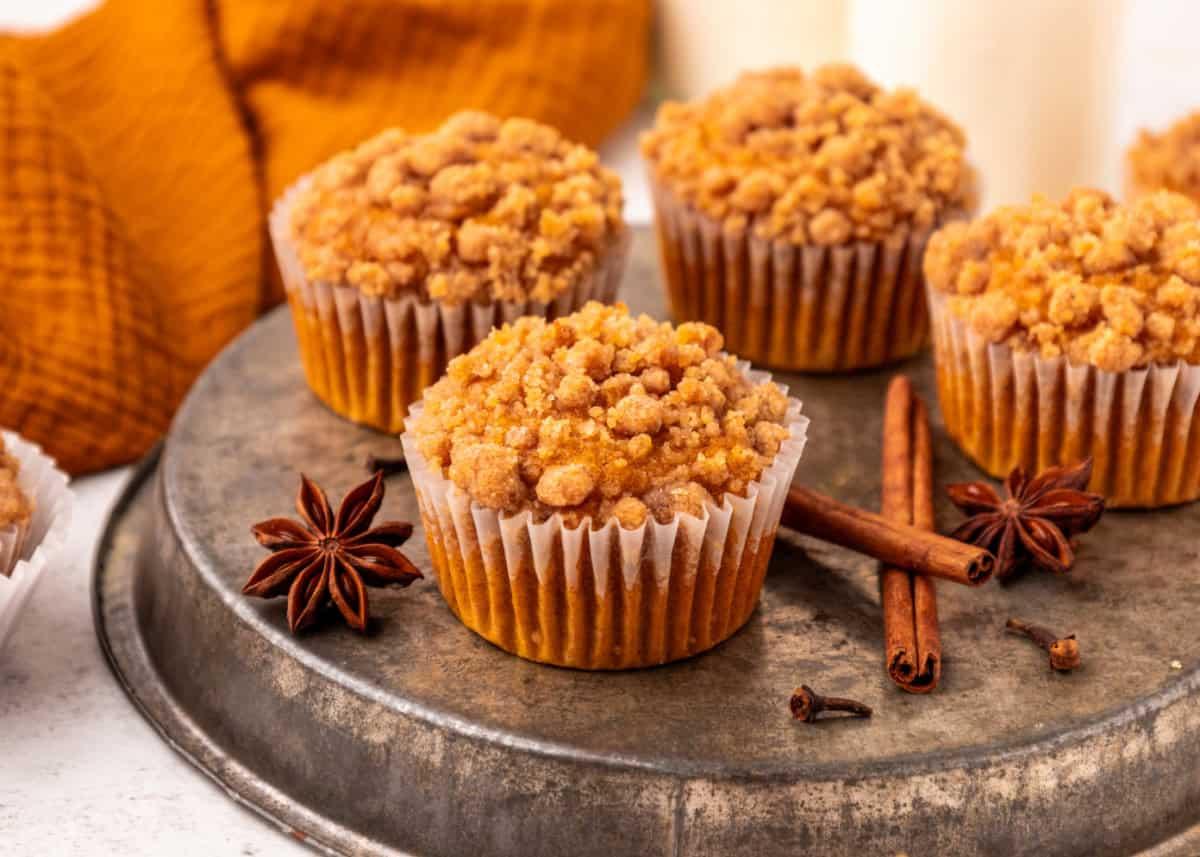 pumpkin streusel muffins on a wooden table