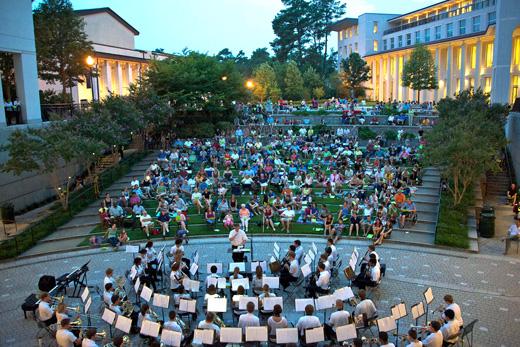 students enjoying an outdoor concert on college campus