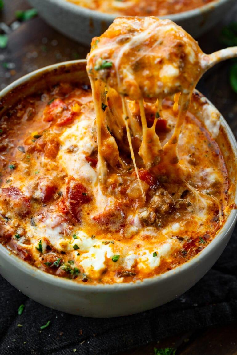 bowl of lasagna soup with melted cheese