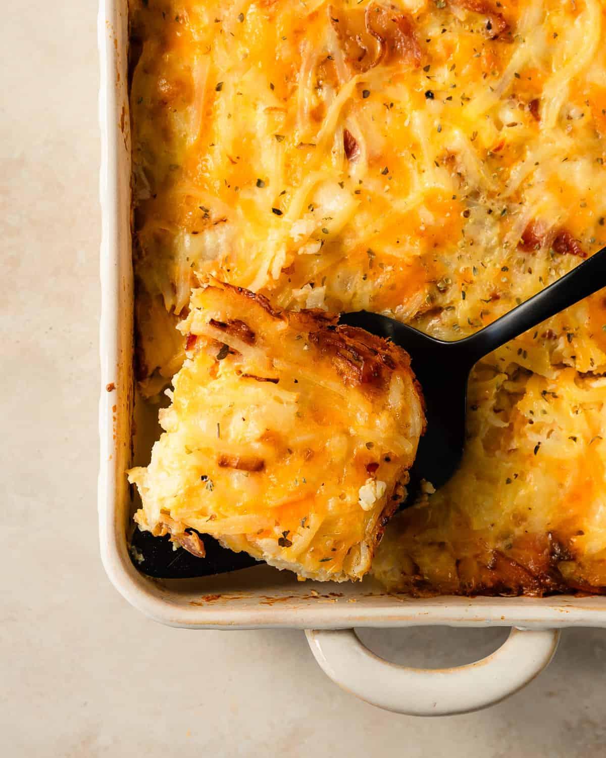 savory overnight breakfast casserole, golden brown, with fresh herbs on top, cozy kitchen setting