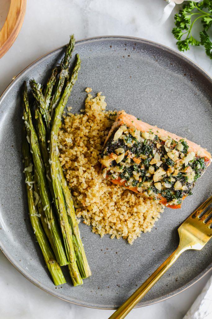 close up shot of salmon with asparagus and quinoa