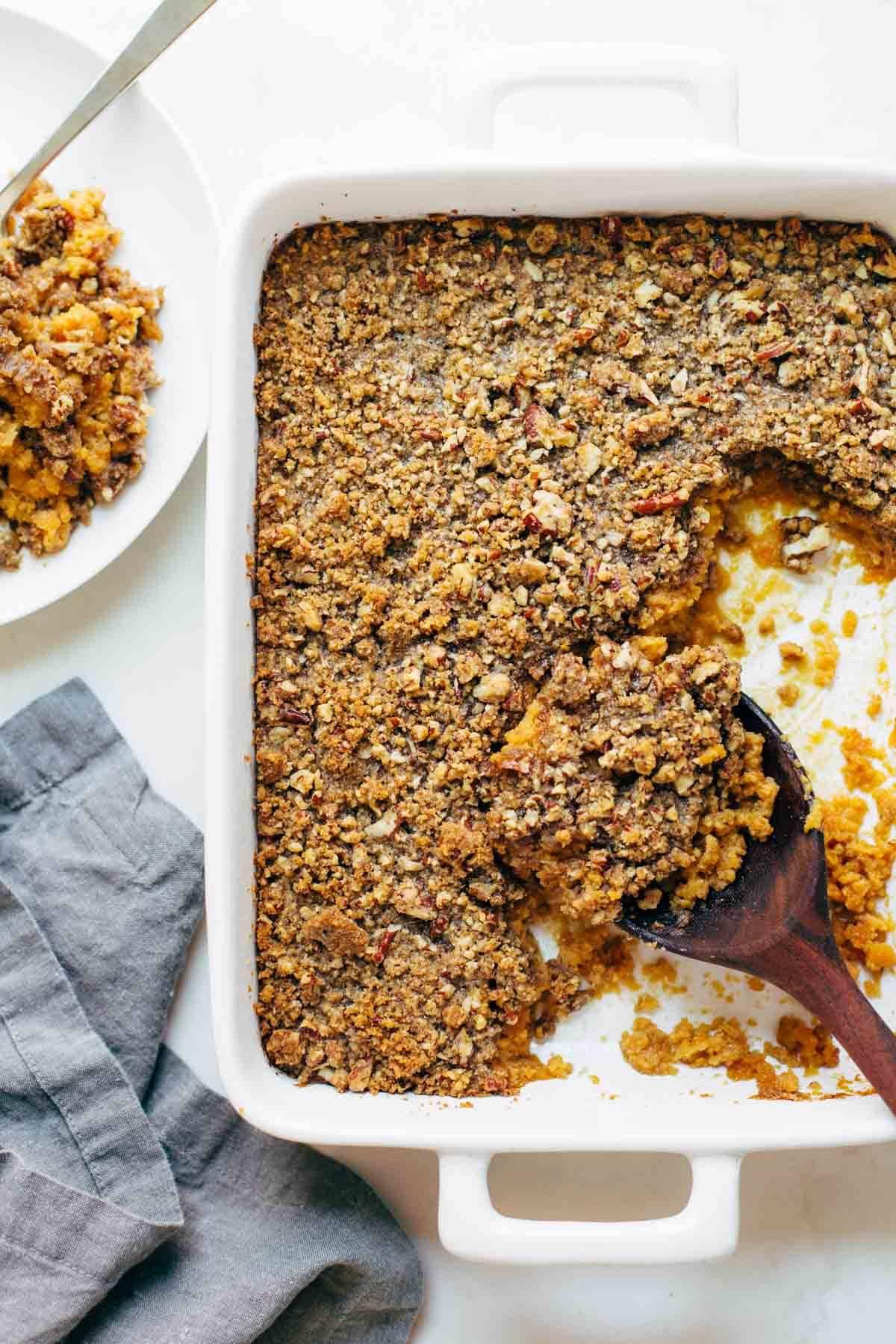 Finished sweet potato casserole with caramelized pecan topping, golden brown and bubbly, ready to serve
