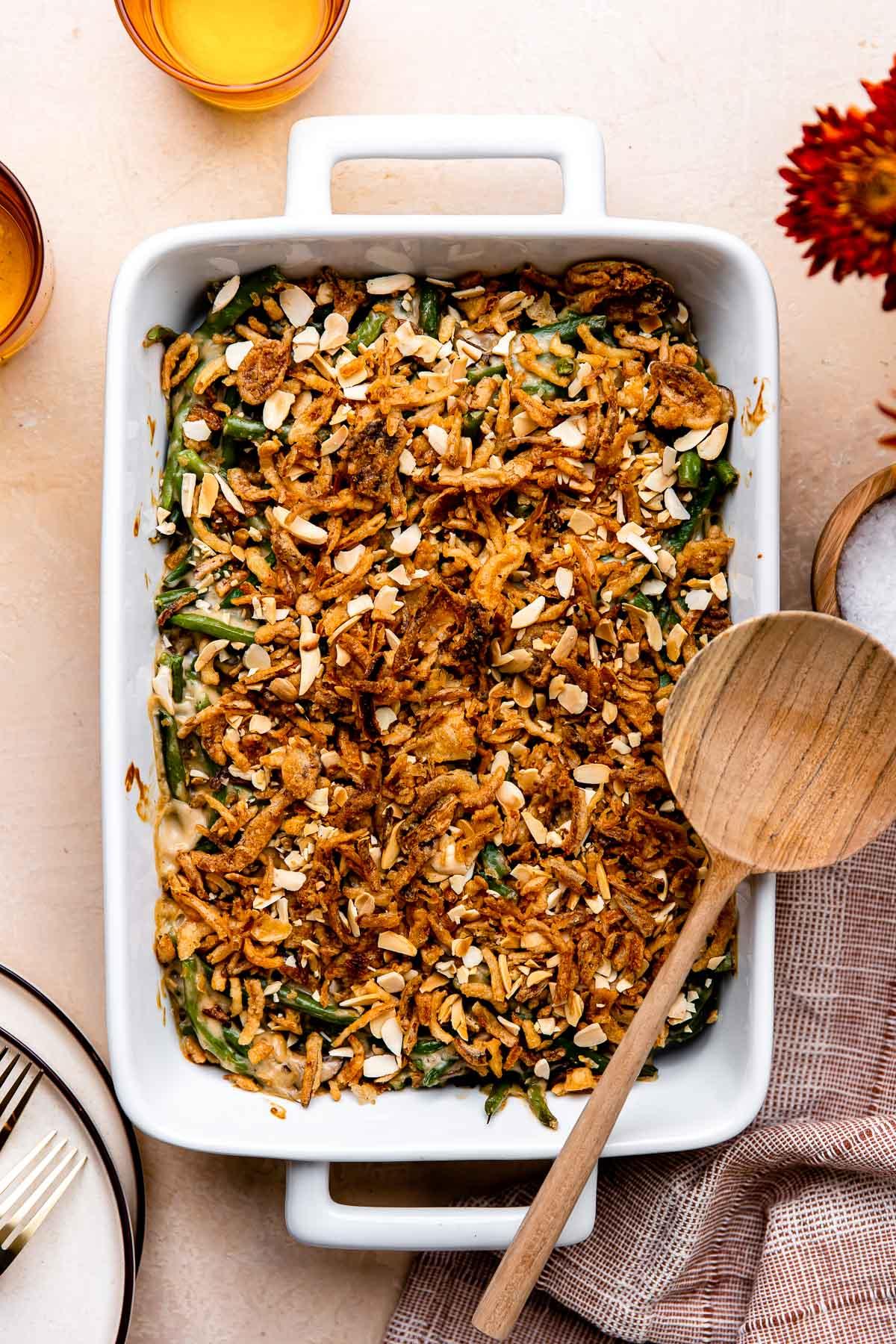 Close up of creamy green bean casserole with golden brown toasted almonds
