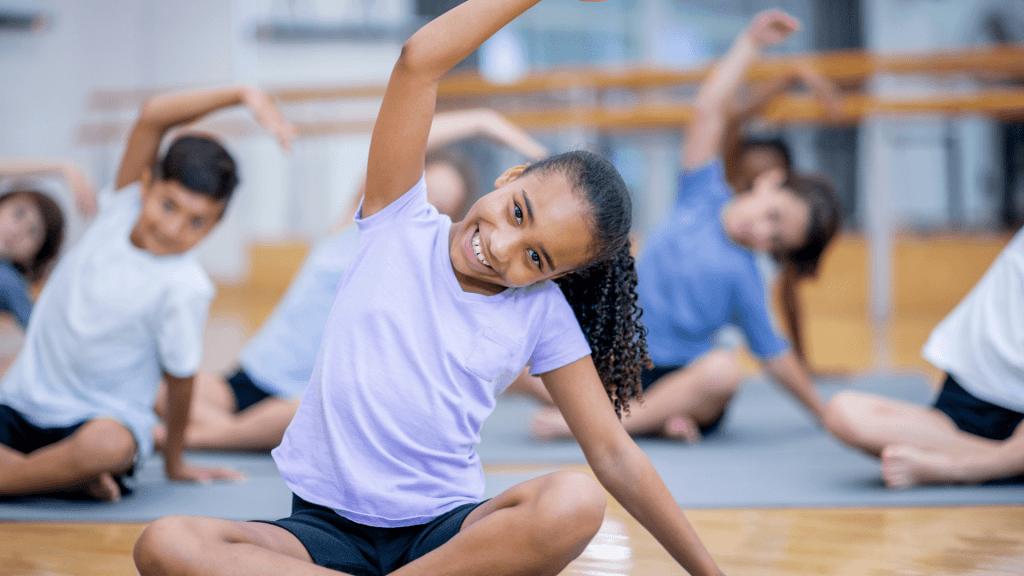 student doing yoga or stretching exercises