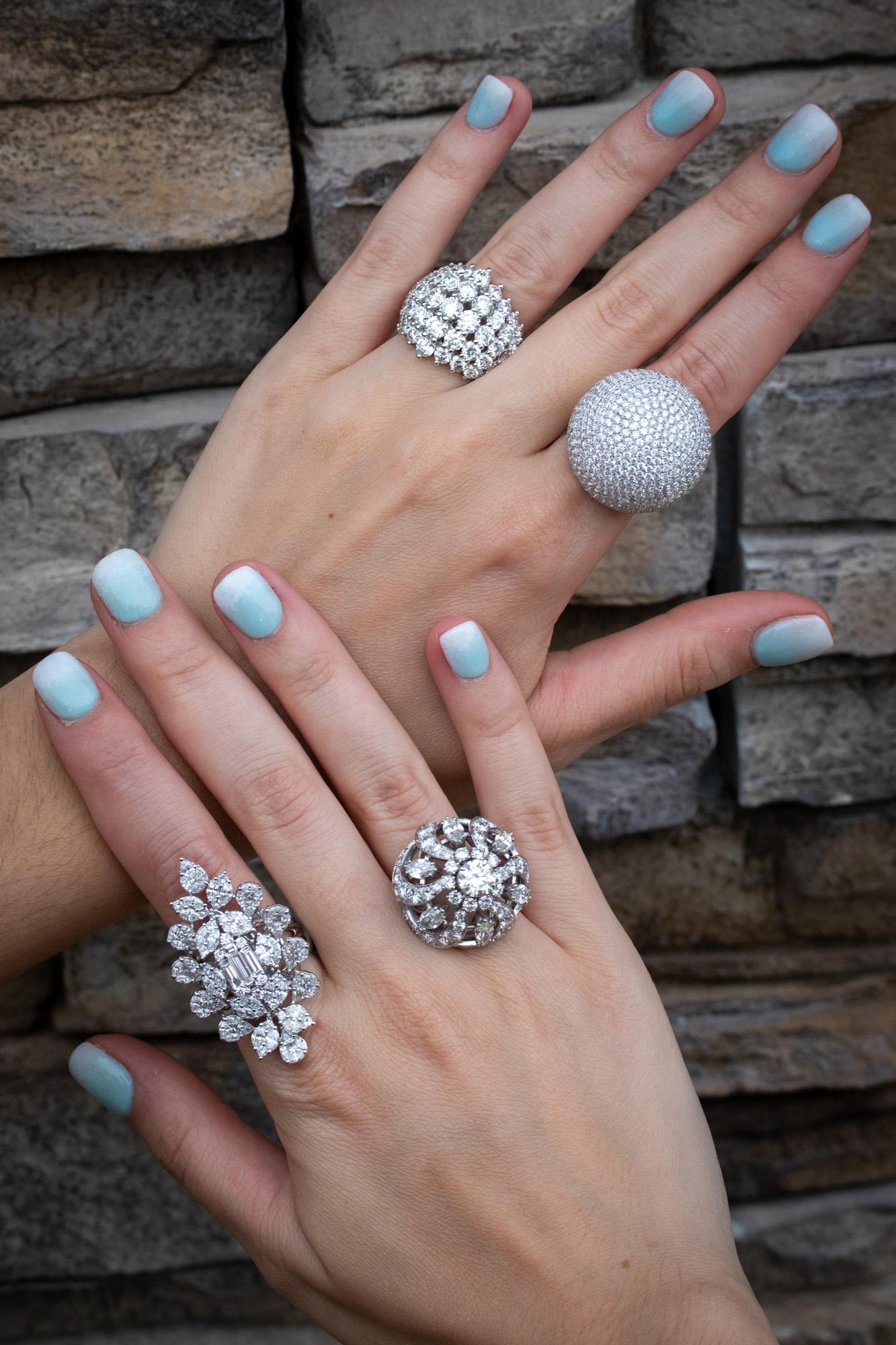 woman's hand wearing a large statement cocktail ring
