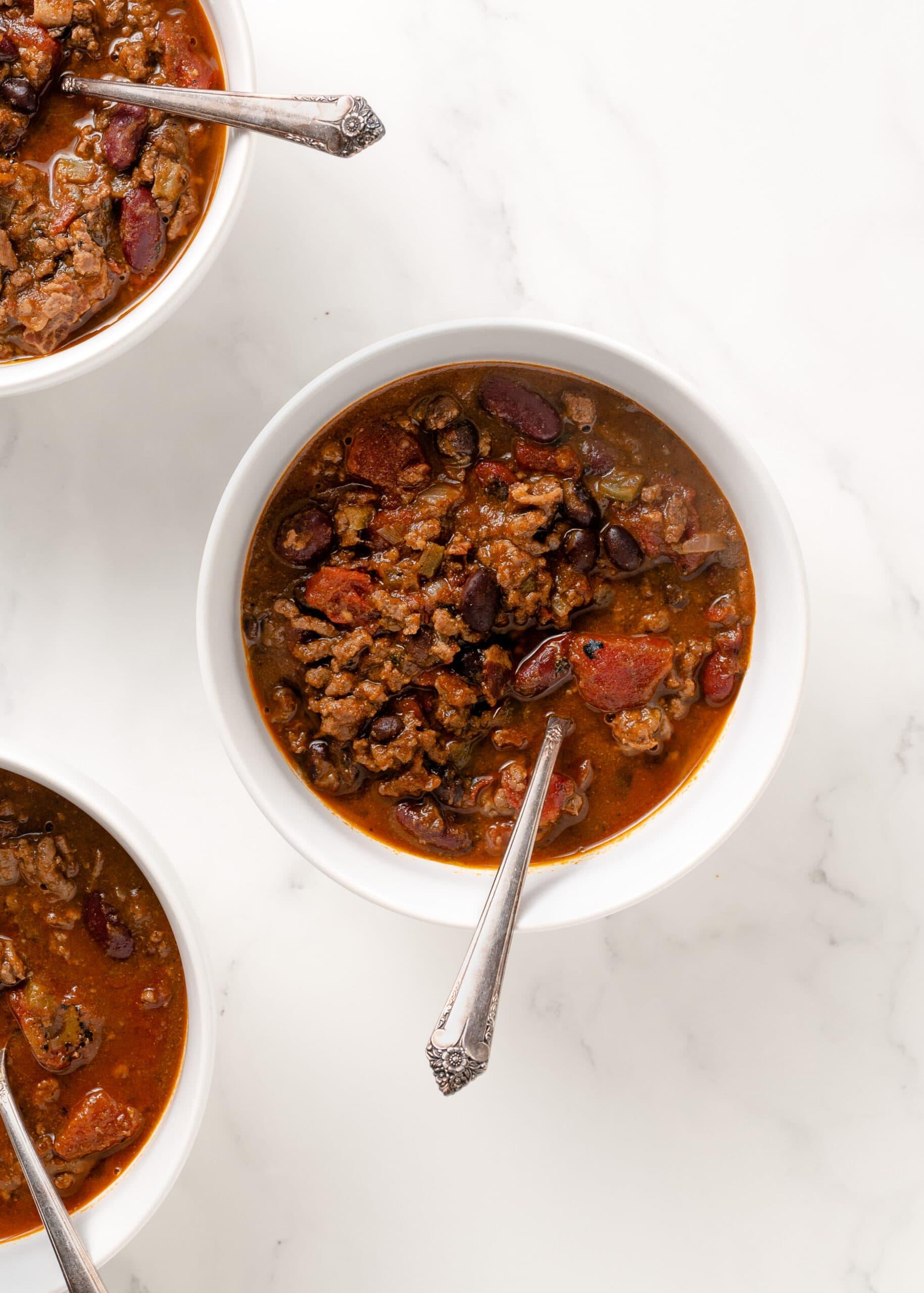 close up of chili simmering in a dutch oven