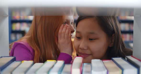 close-up of teenagers whispering secrets