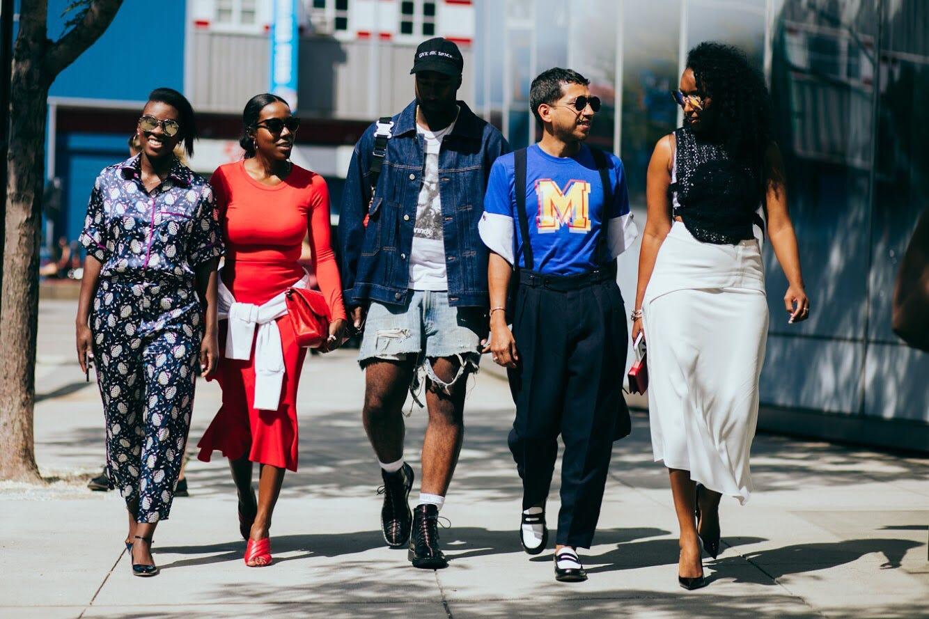 diverse group of people enjoying streetwear fashion at a city event