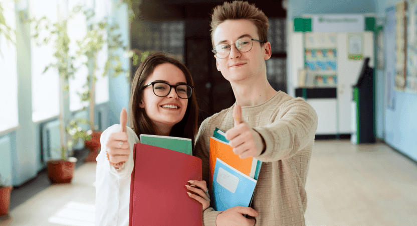 student smiling with well-organized notes
