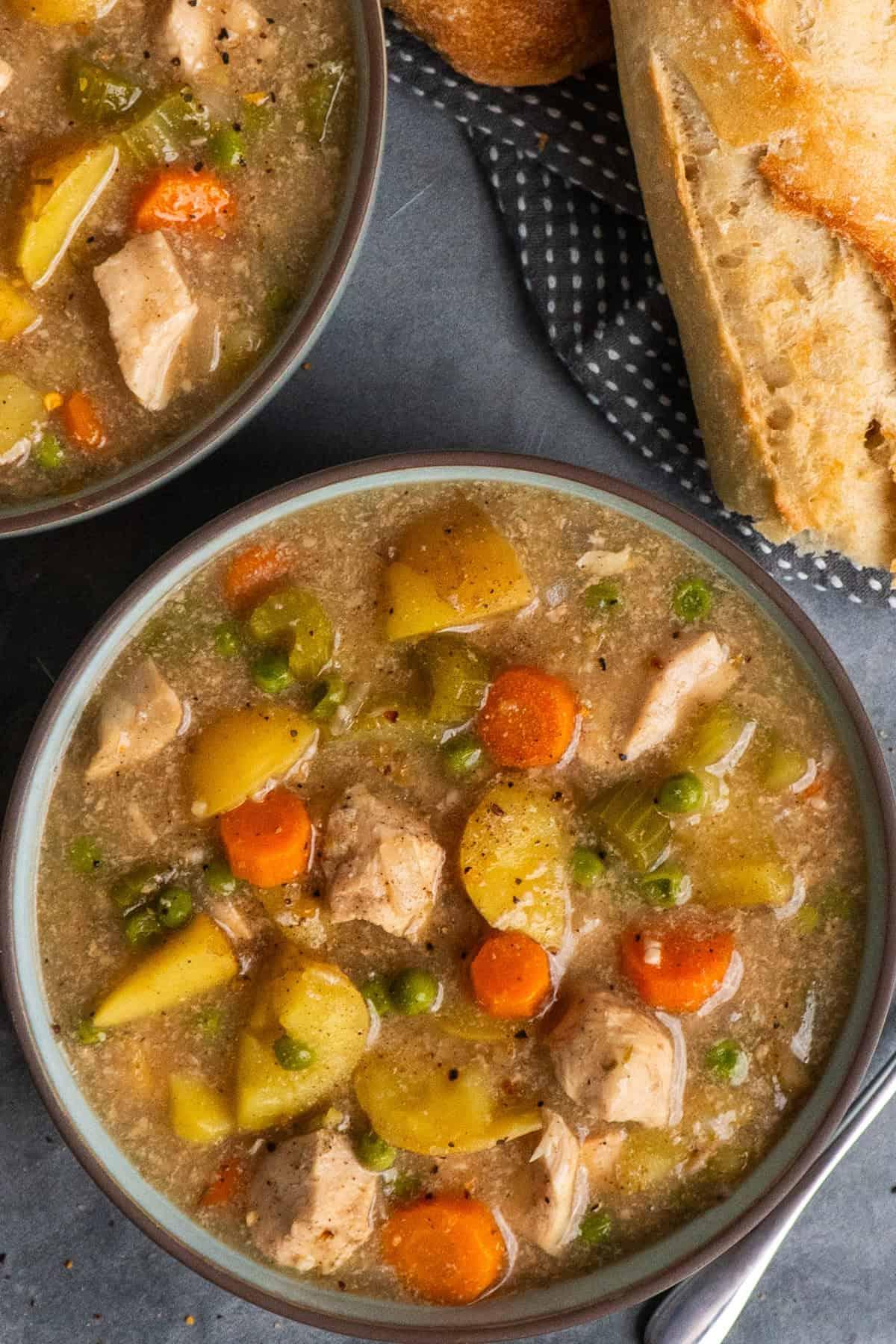 slow cooker chicken stew bubbling in a slow cooker