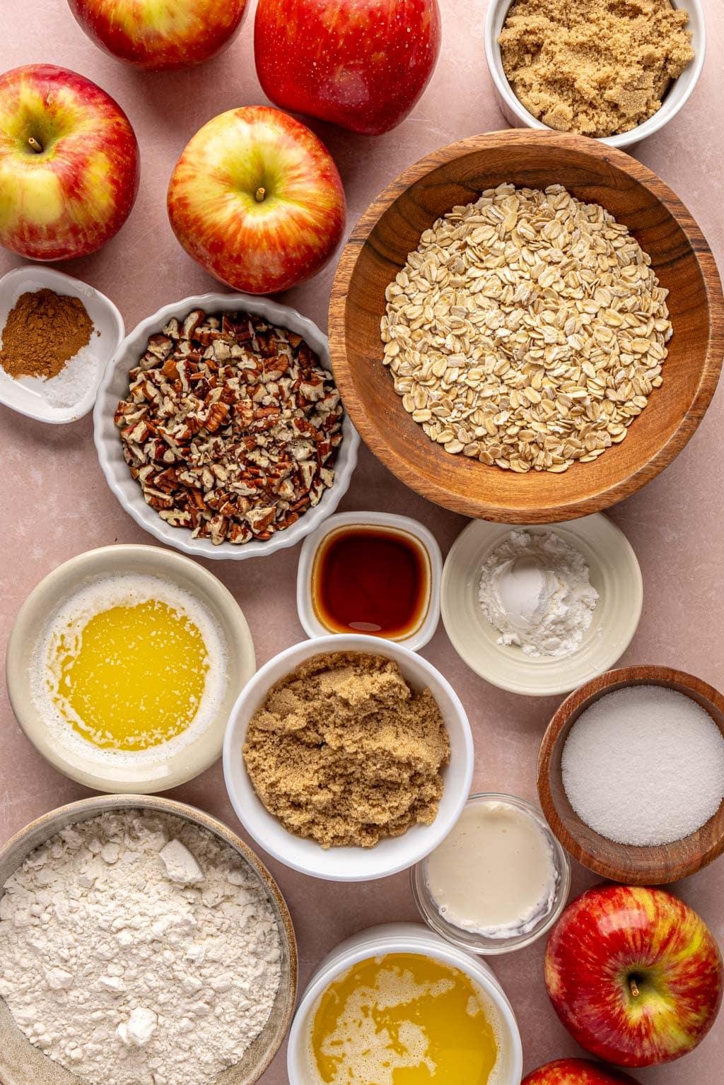 ingredients for apple crisp laid out on a wooden table