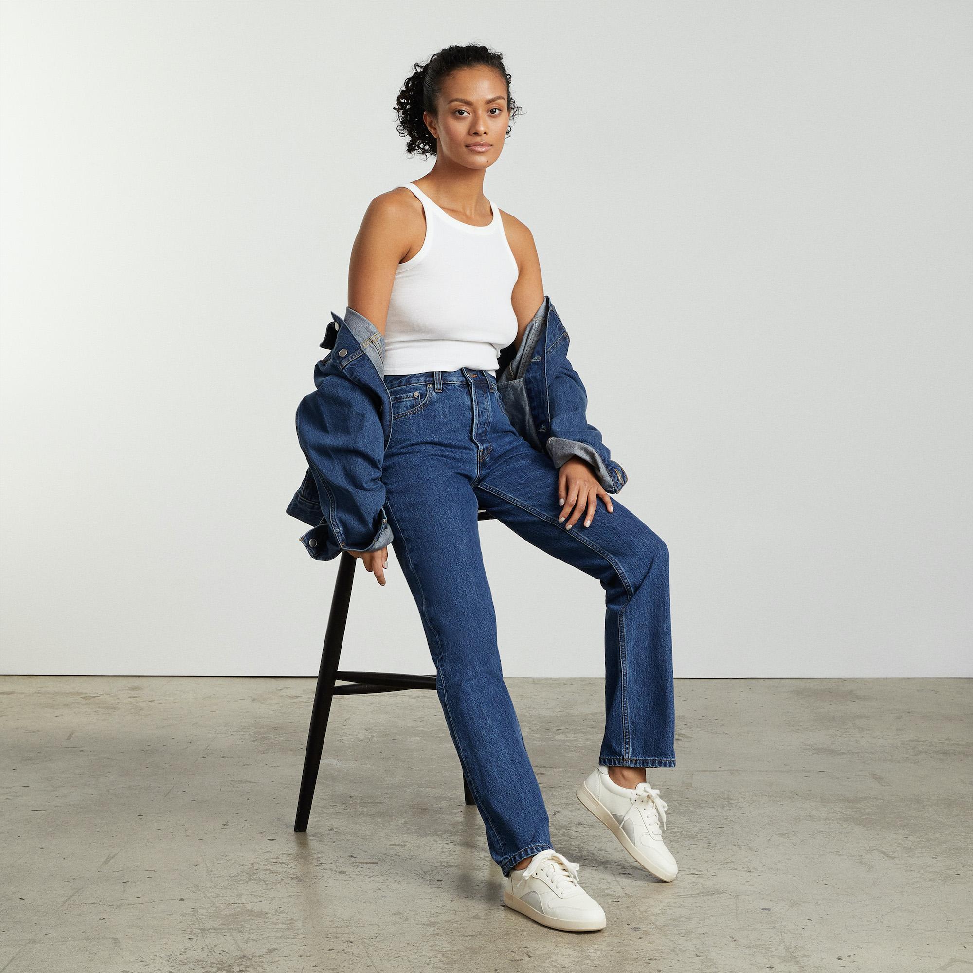 A model wearing Everlane jeans; highlighting the jeans, model, and background branding.