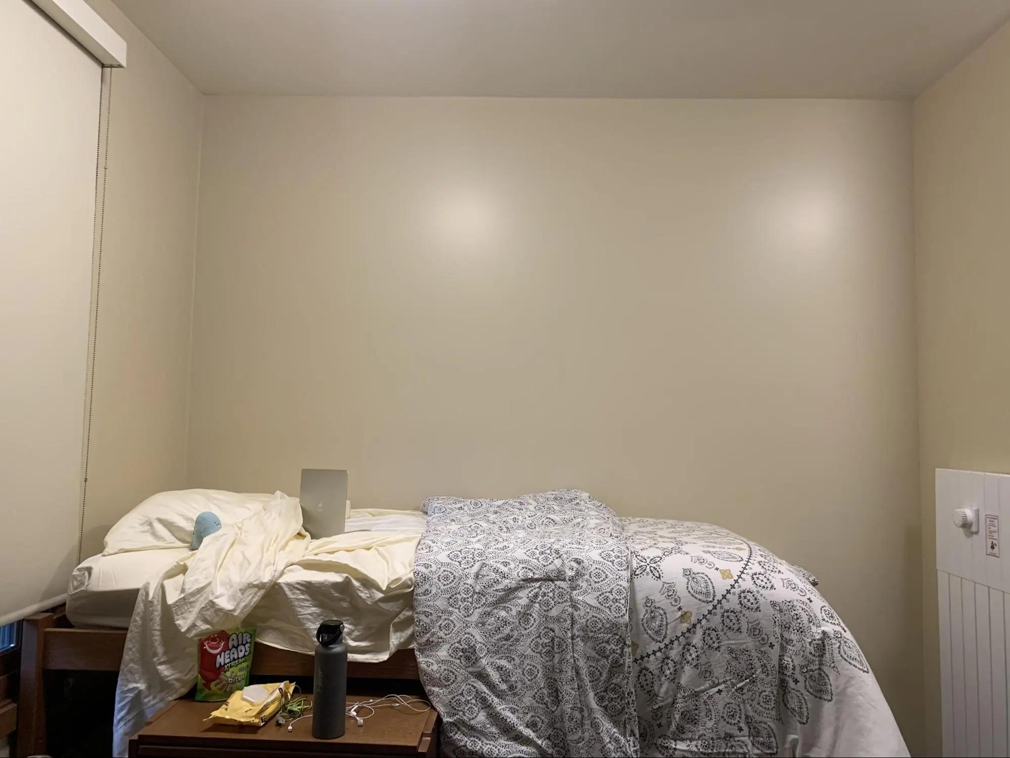 Empty dorm room with blank walls