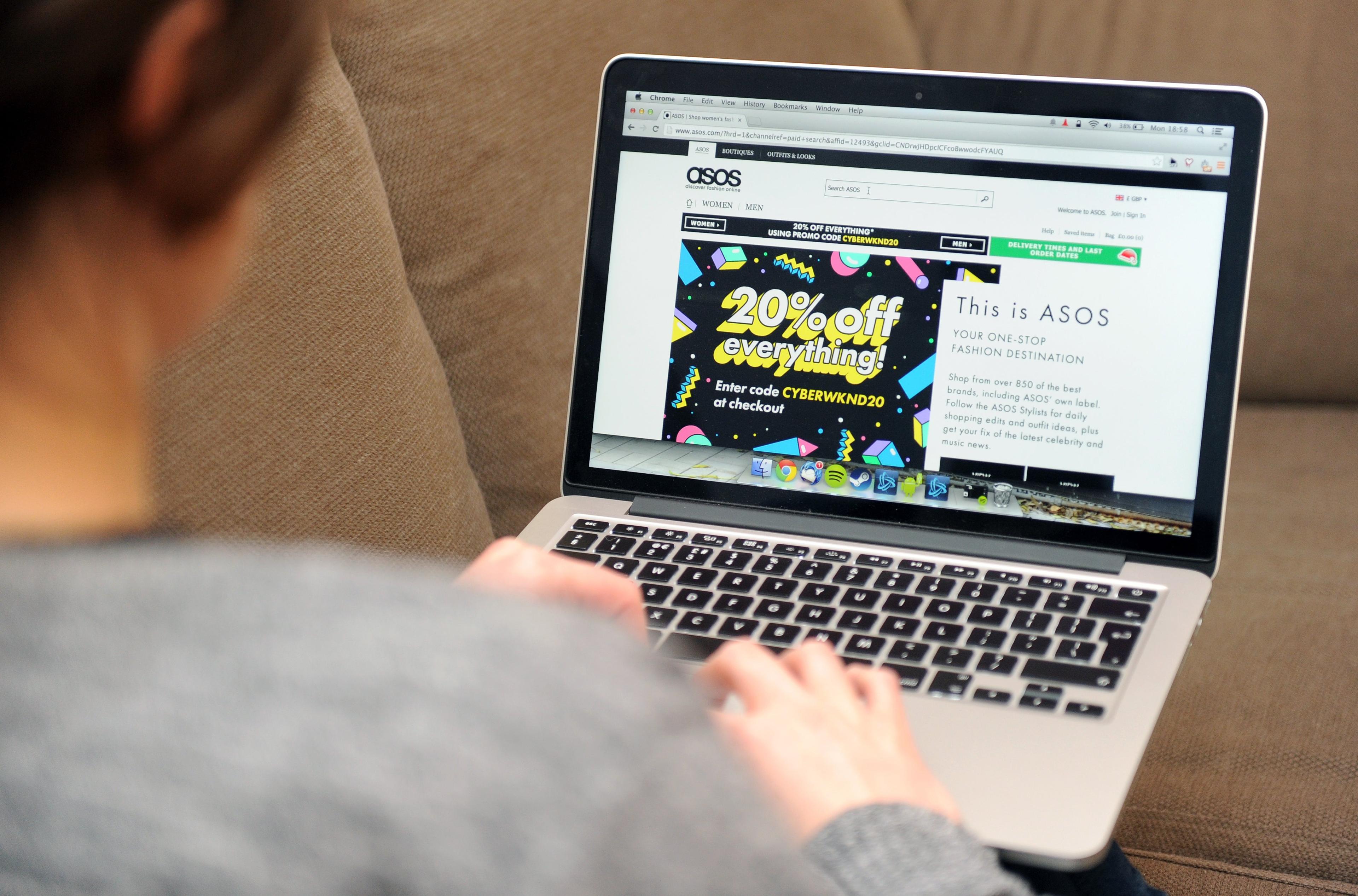 woman browsing ASOS website on laptop