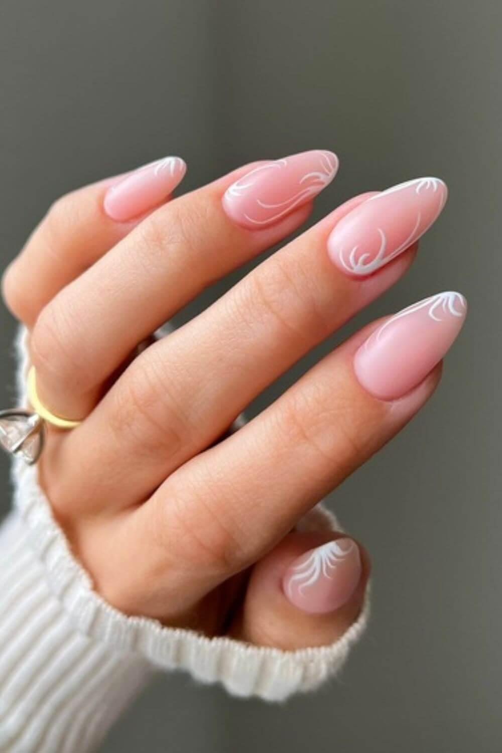 woman admiring her almond-shaped nails