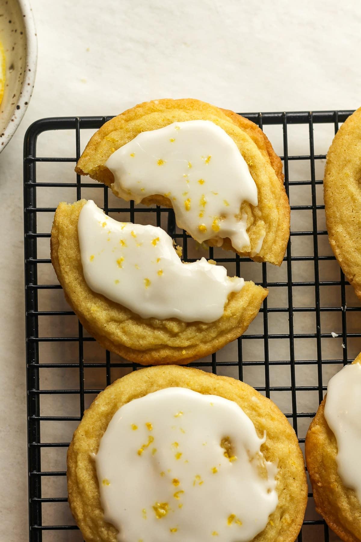 A close-up shot of a perfectly glazed citrus cookie cooling on a wire rack