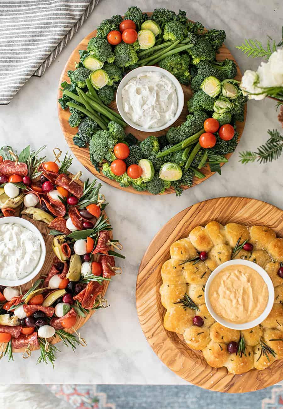A variety of holiday appetizers arranged on a platter, with a focus on garlic knots