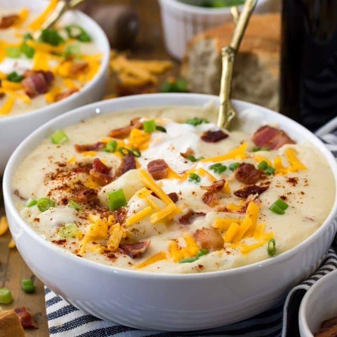 bowl of homemade loaded potato soup with toppings