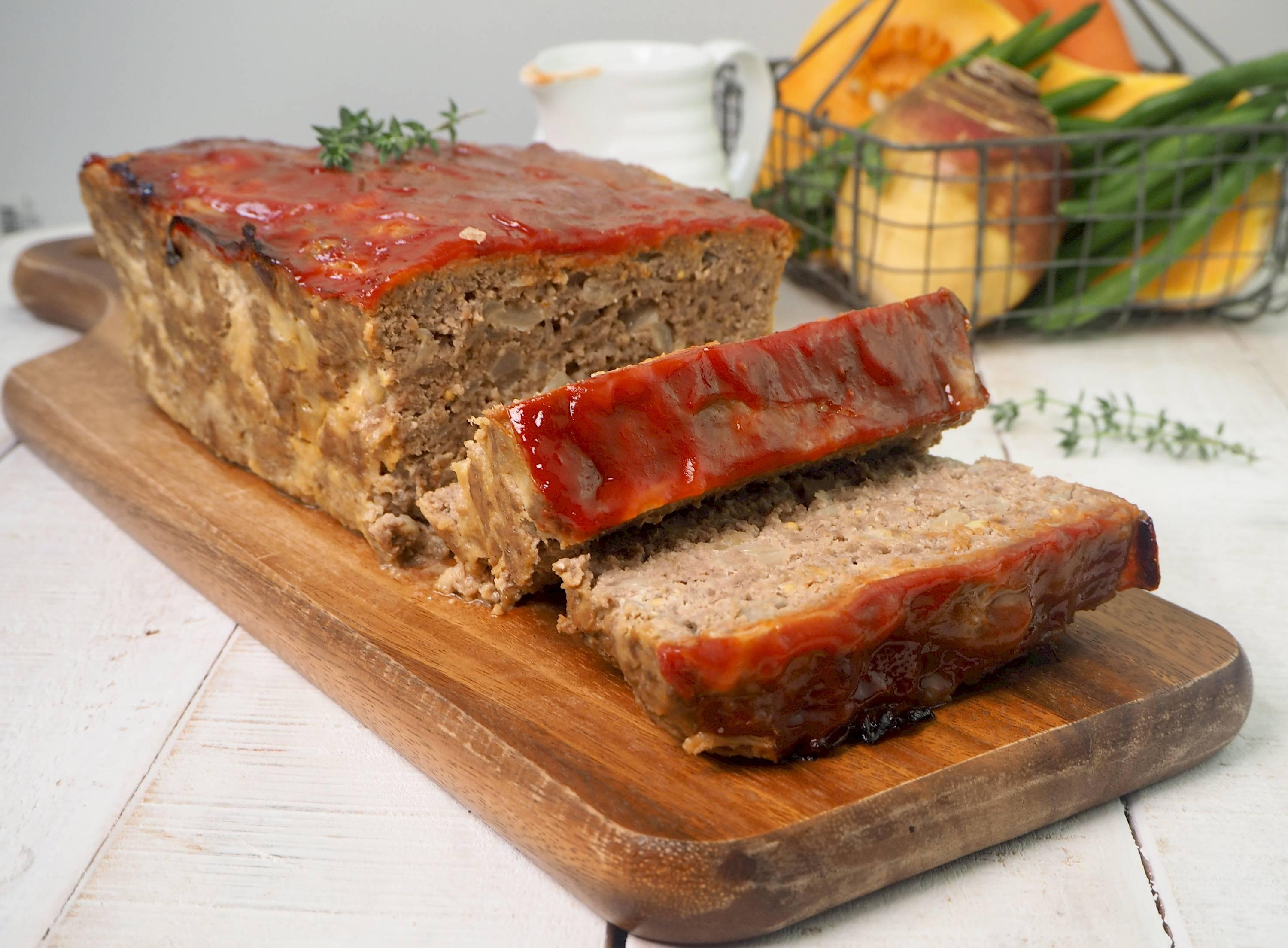 classic meatloaf on a wooden cutting board