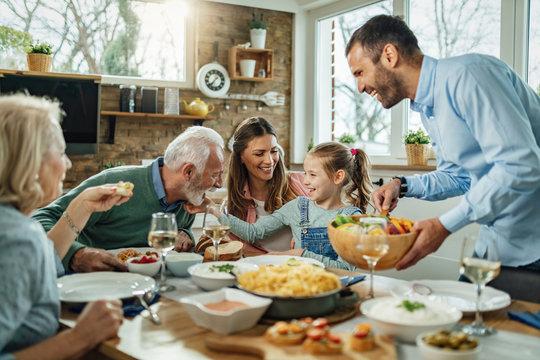 happy family eating dinner together
