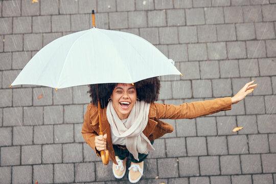 woman smiling cheerfully despite rainy weather