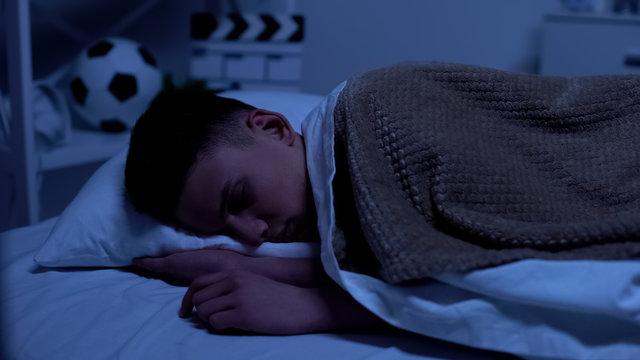 student sleeping peacefully in bed