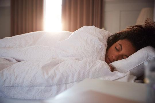 person sleeping peacefully in a comfortable bed