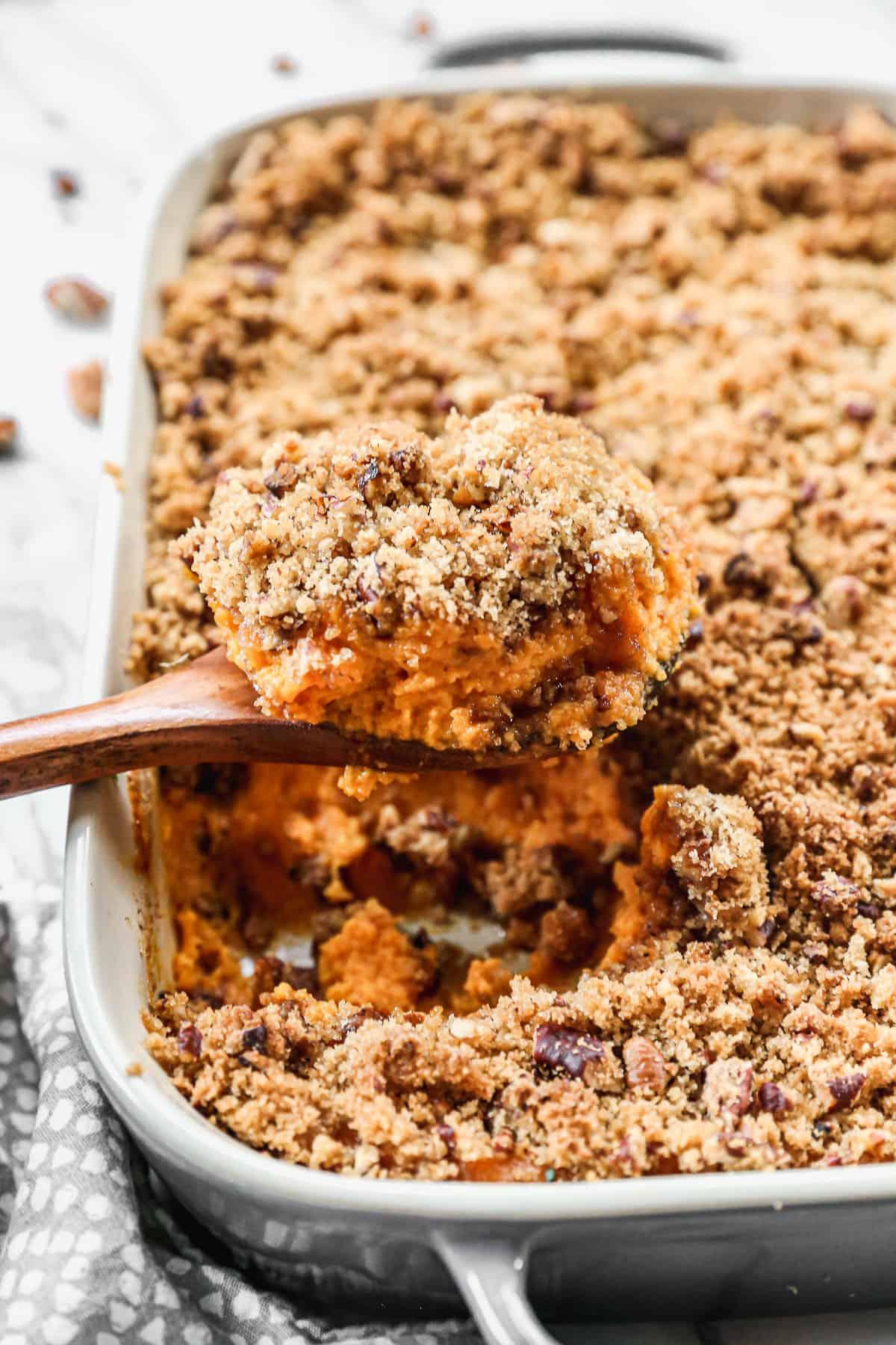 Deliciously creamy whipped sweet potato casserole with golden brown sugar pecan topping, ready for holiday table