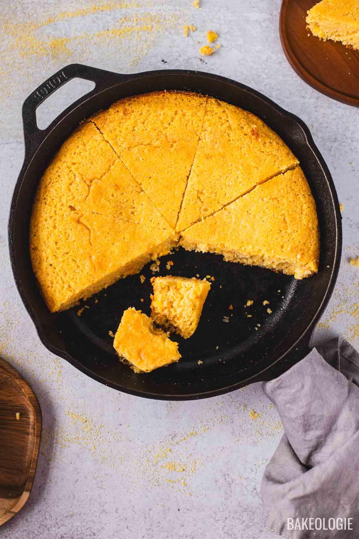 slice of skillet cornbread with a perfectly tender crumb, close-up texture shot