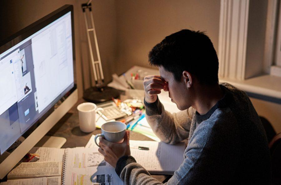stressed student studying late at night