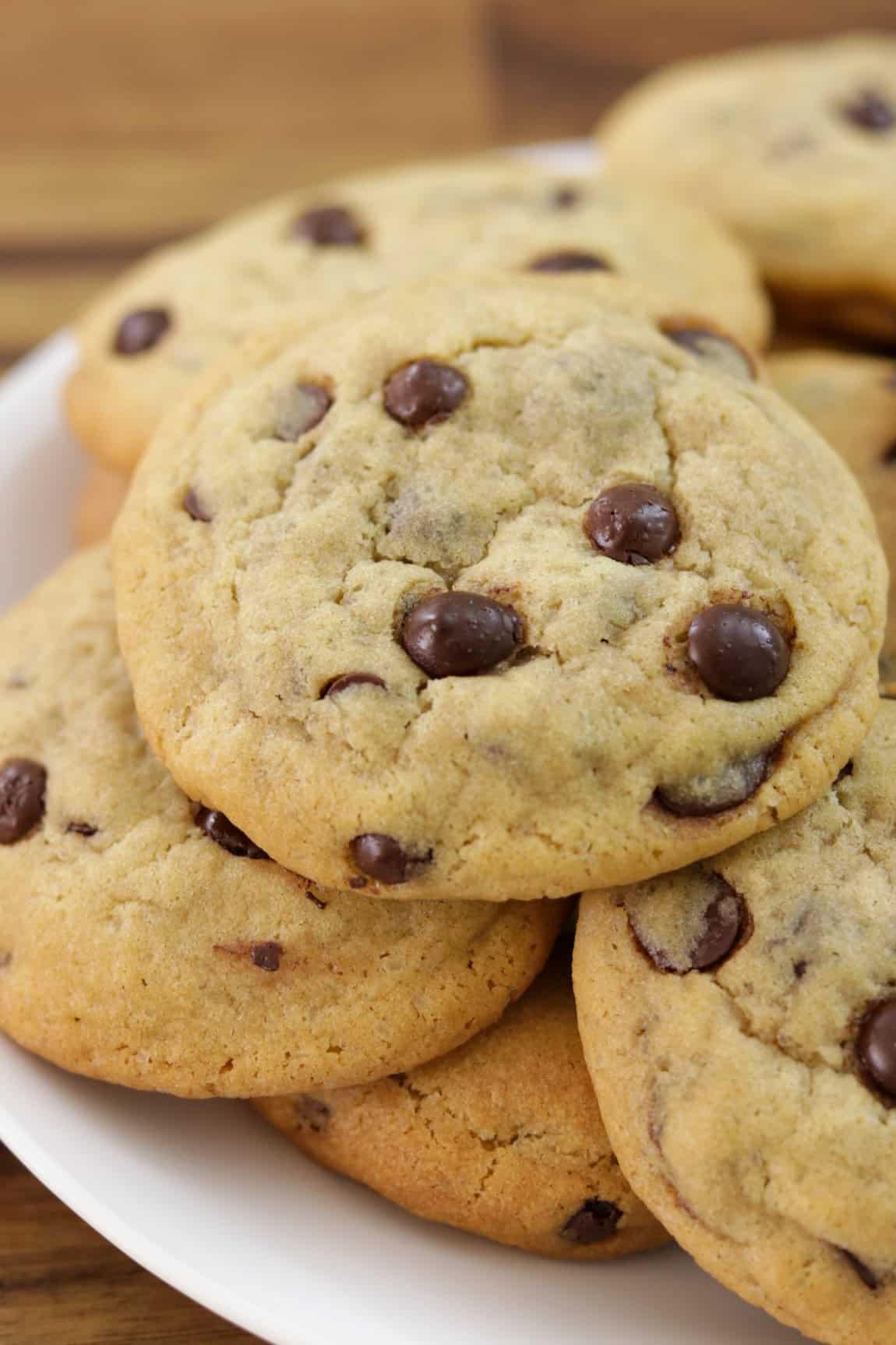 close-up shot of a stack of soft, thick chocolate chip cookies