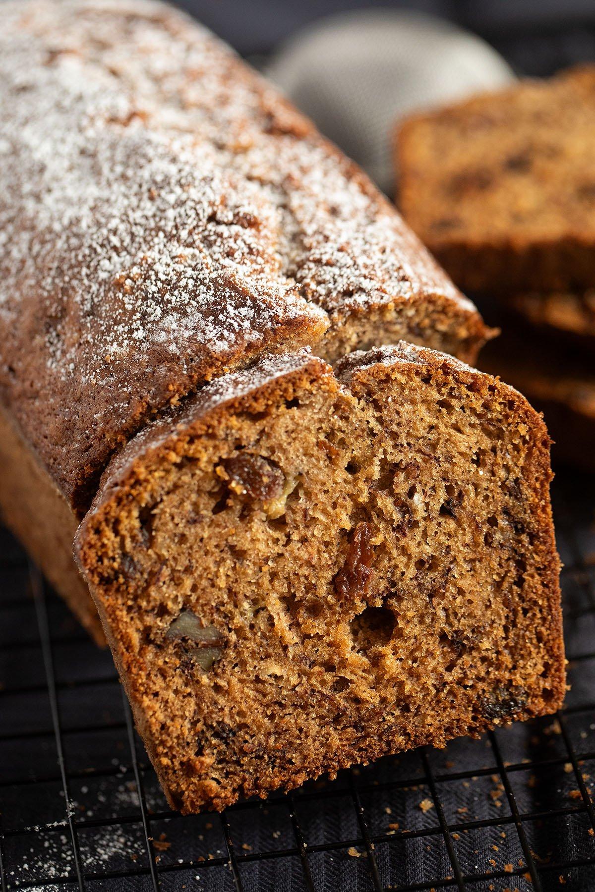 gluten-free banana bread with golden raisins on a wire rack