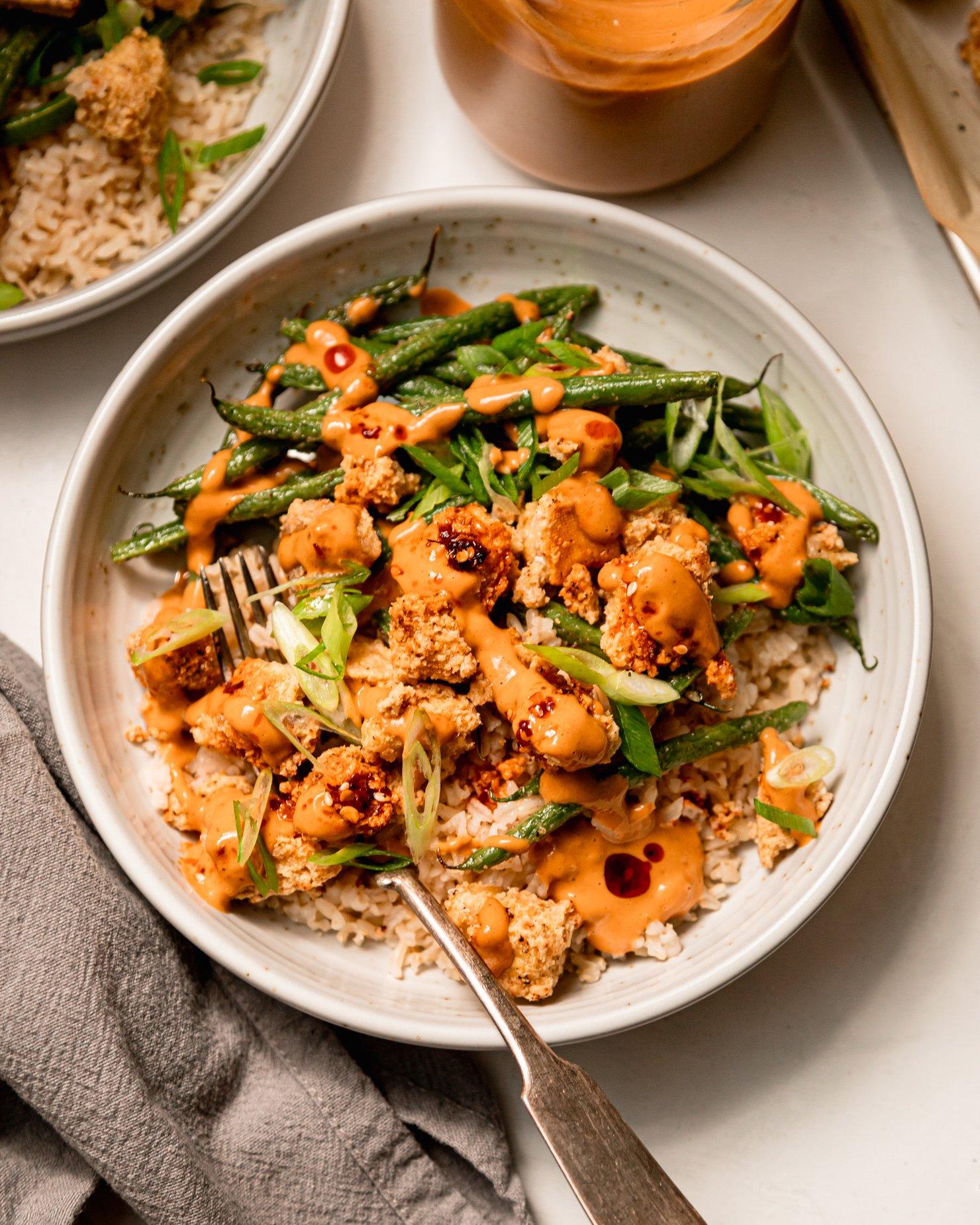 Spicy Peanut Tofu Stuffed Zucchini on a wooden platter
