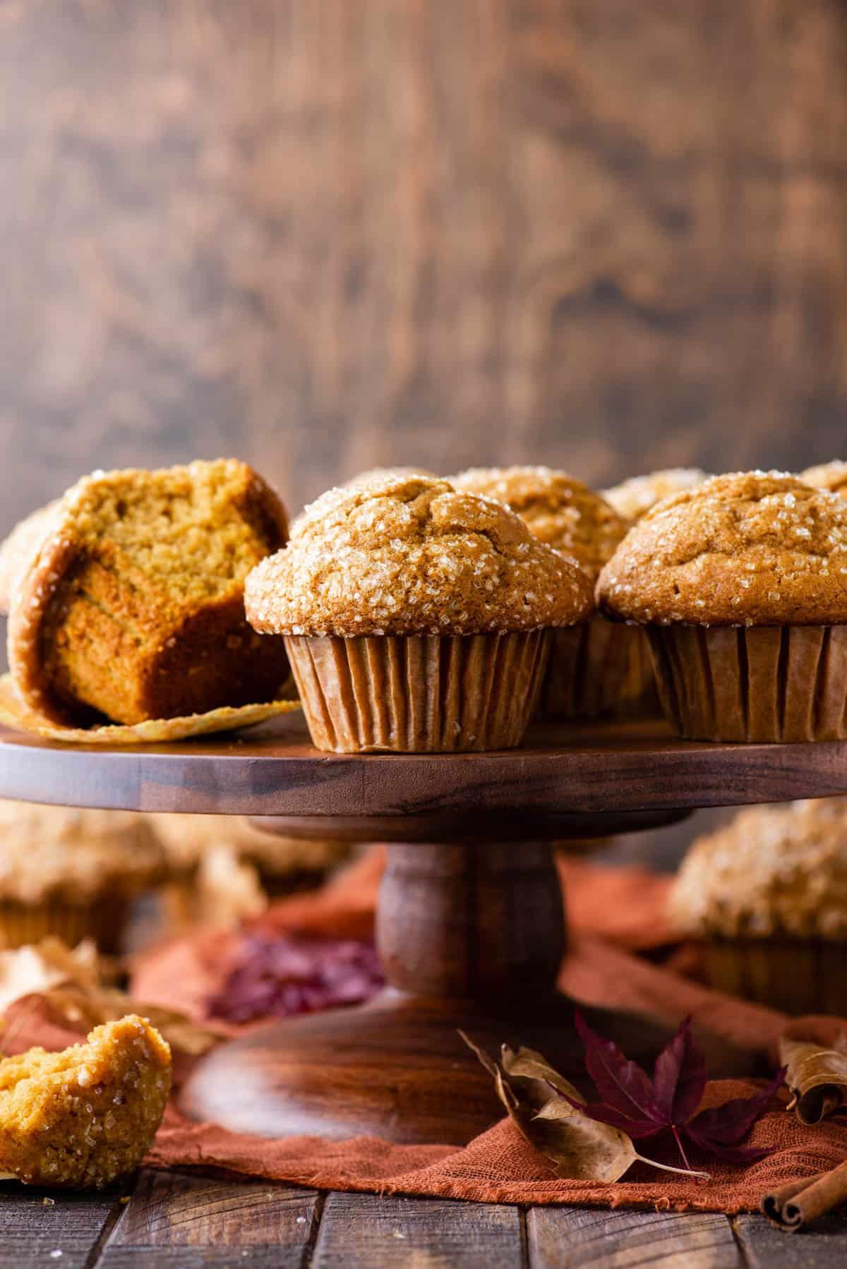 freshly baked pumpkin muffins on a wooden surface