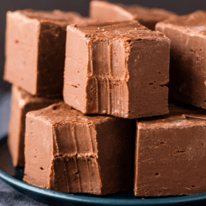 homemade silky chocolate fudge squares close-up, stacked