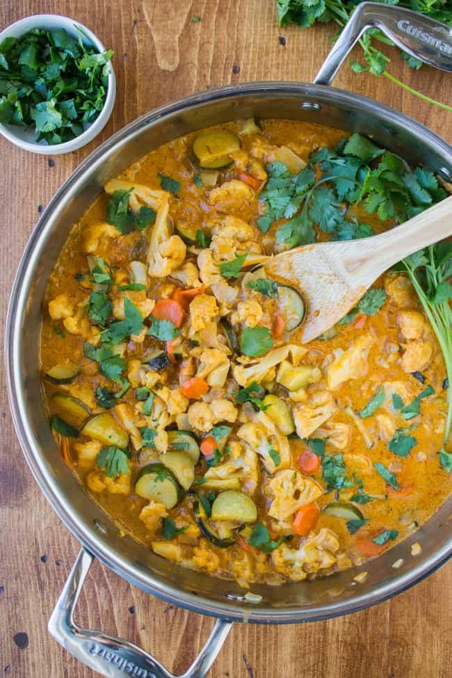 large pot of vegetable curry simmering on stove