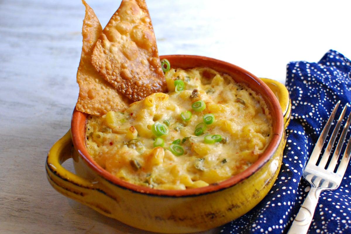 ingredients for crab rangoon mac and cheese laid out on a wooden table