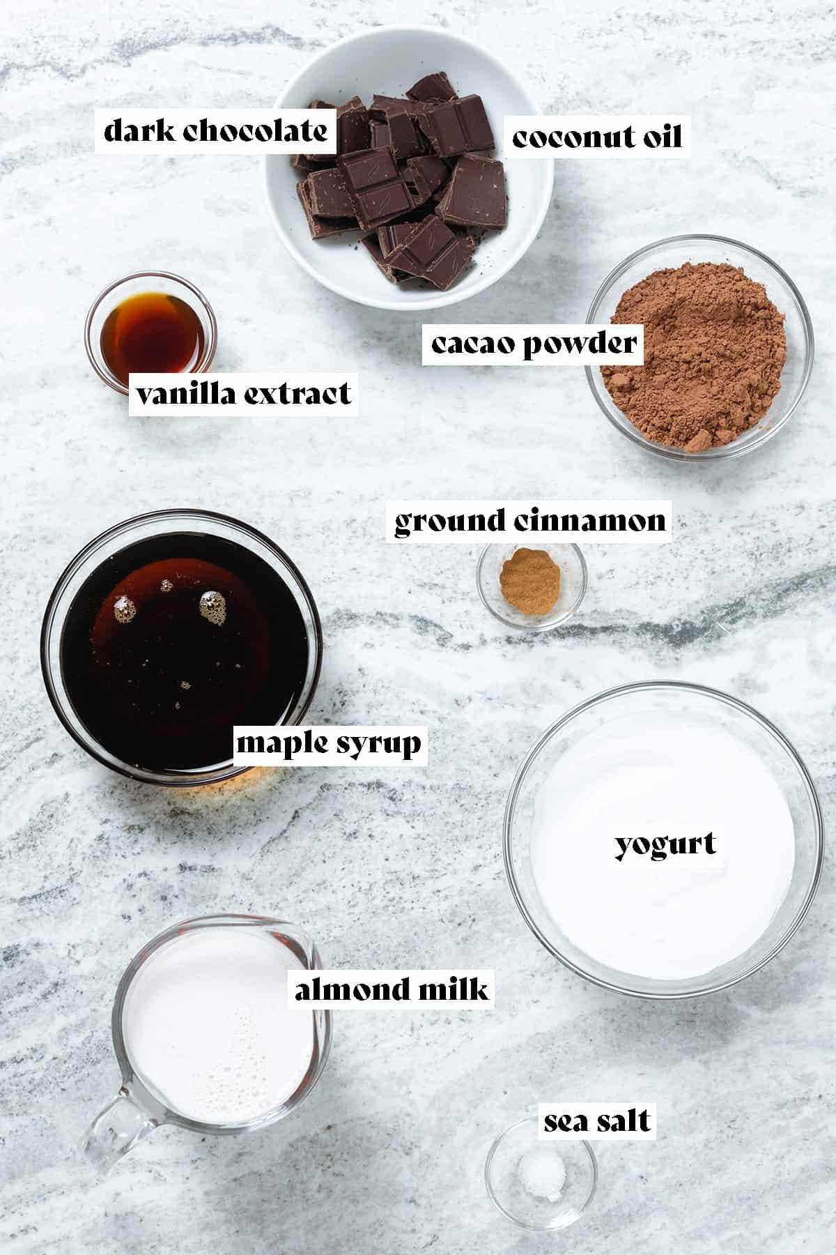 ingredients for almond milk hot chocolate laid out on a kitchen counter