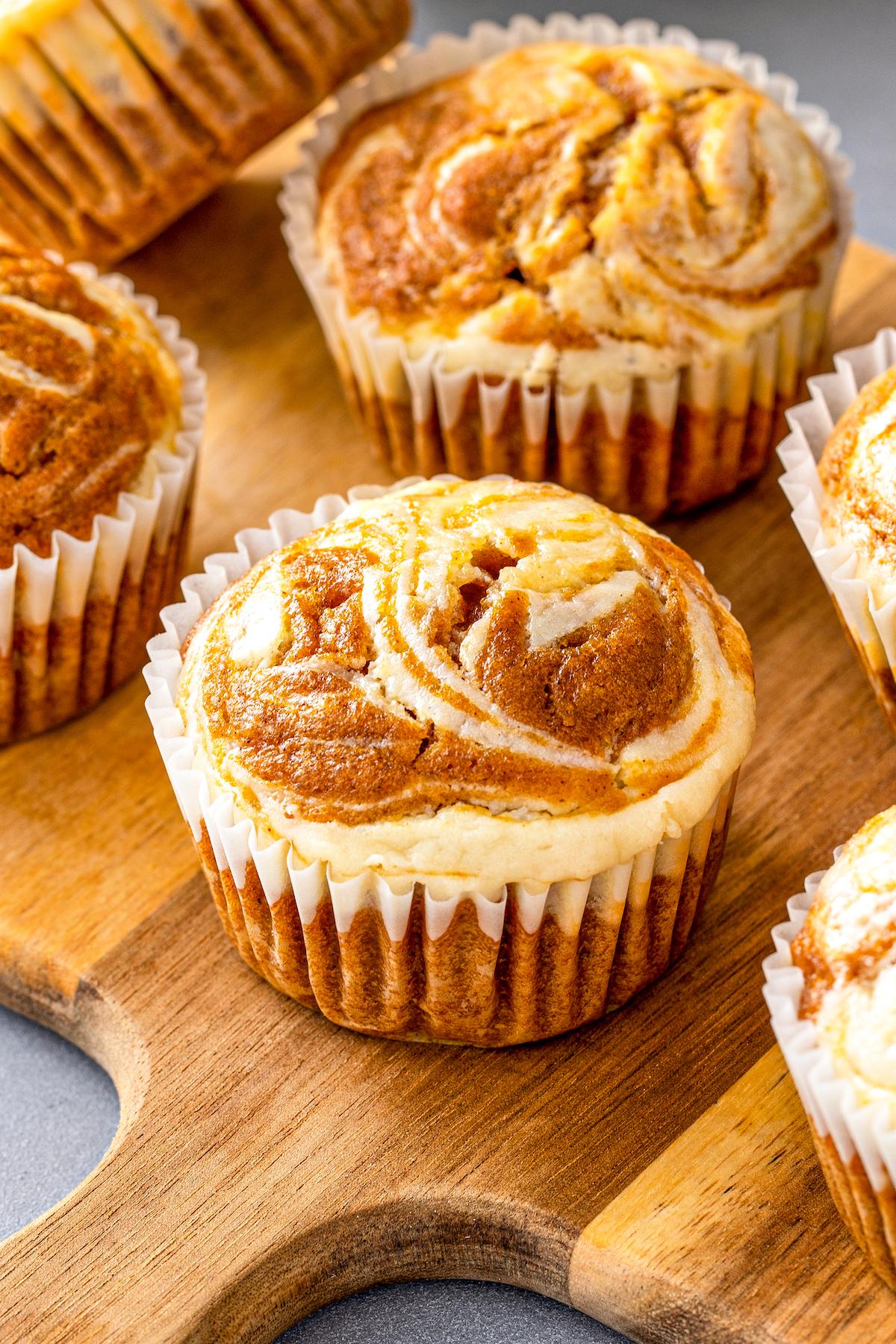 overhead shot of pumpkin muffins with cream cheese swirl