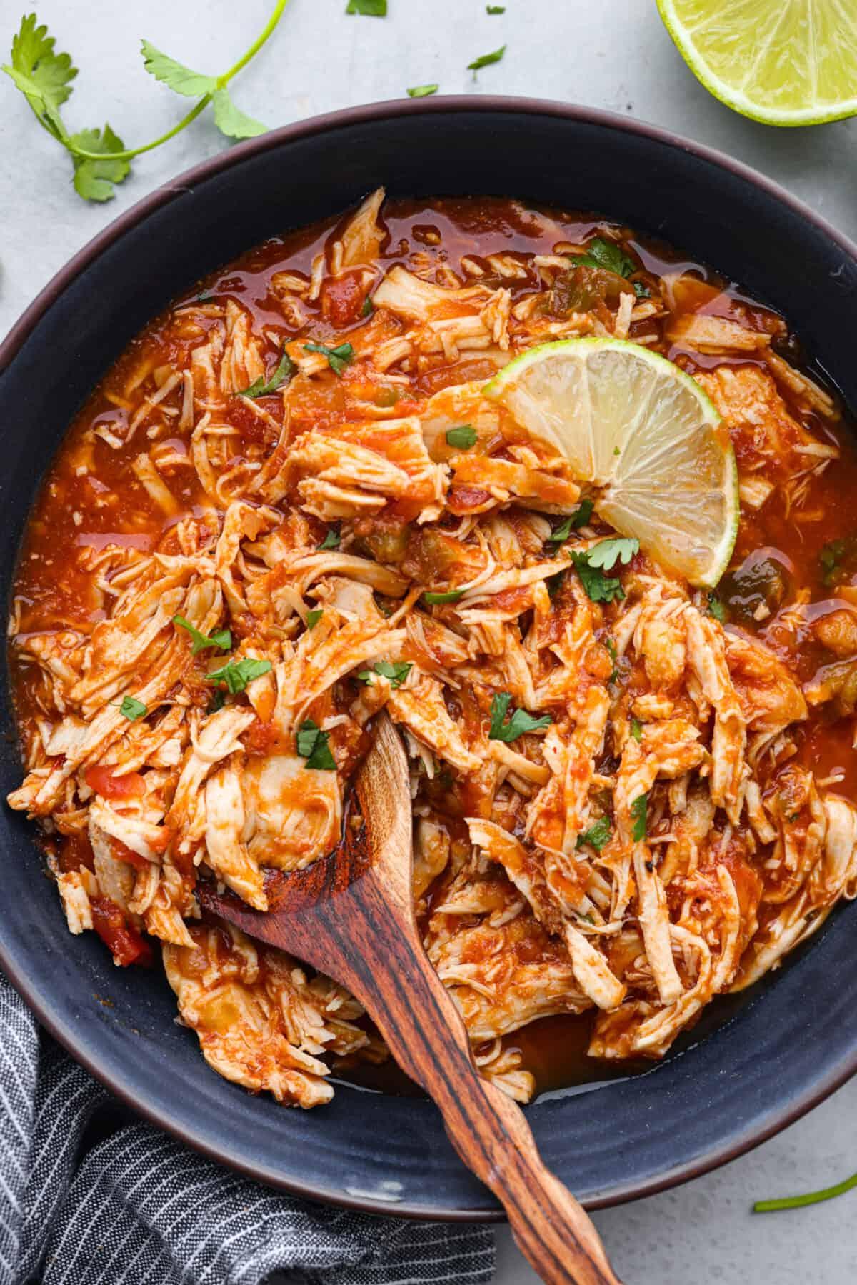 slow cooker summer salsa chicken garnished with cilantro