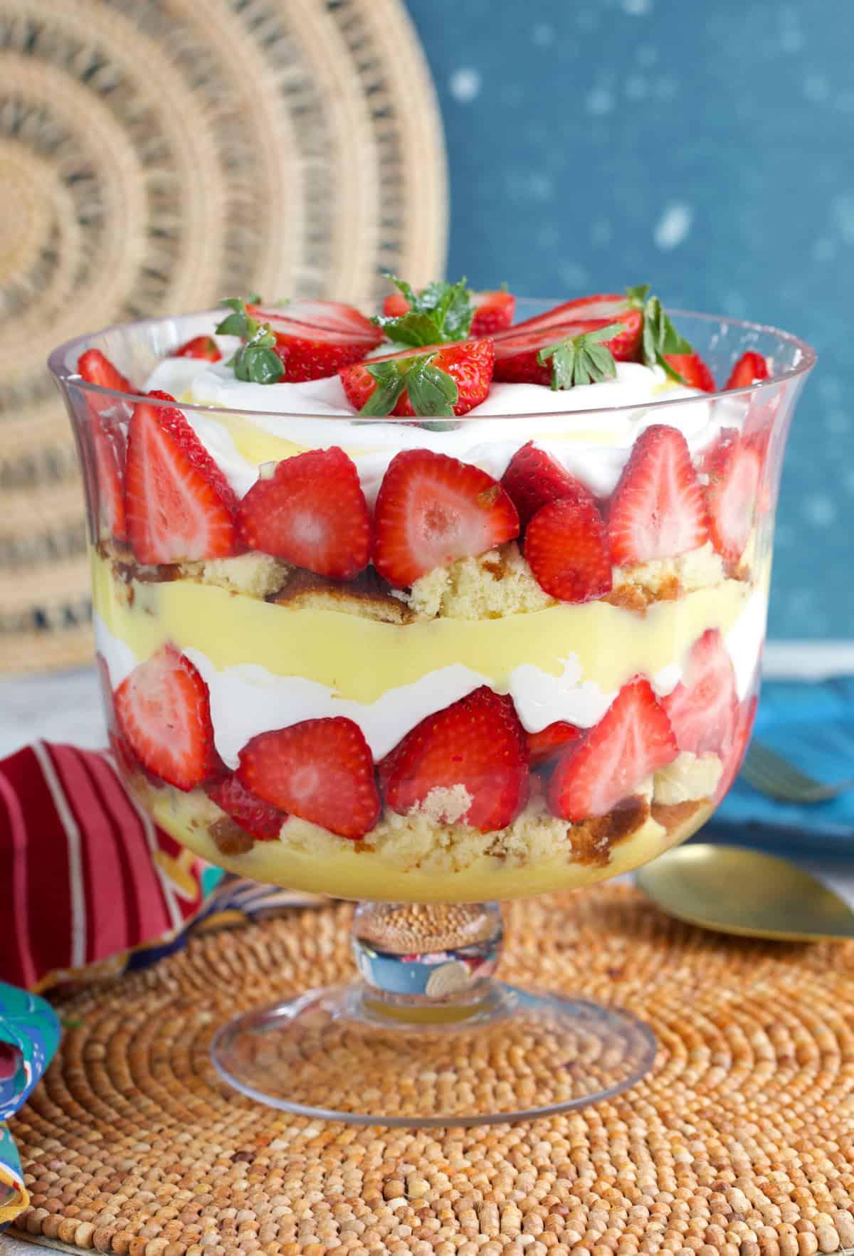 Overhead shot of a beautifully layered strawberry trifle in a glass dish