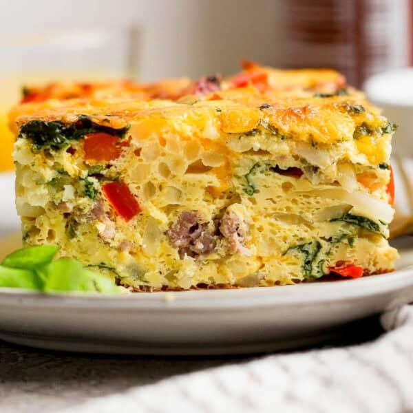 Delicious golden brown breakfast bake fresh out of the oven, garnished with fresh parsley