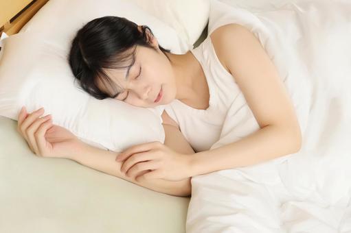 woman sleeping soundly in bed