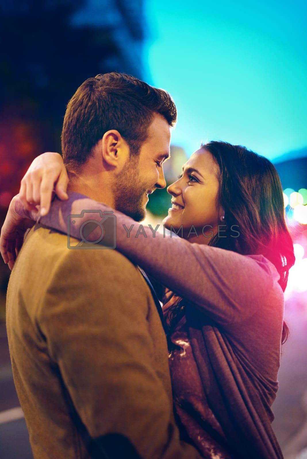couple smiling and hugging after a date night