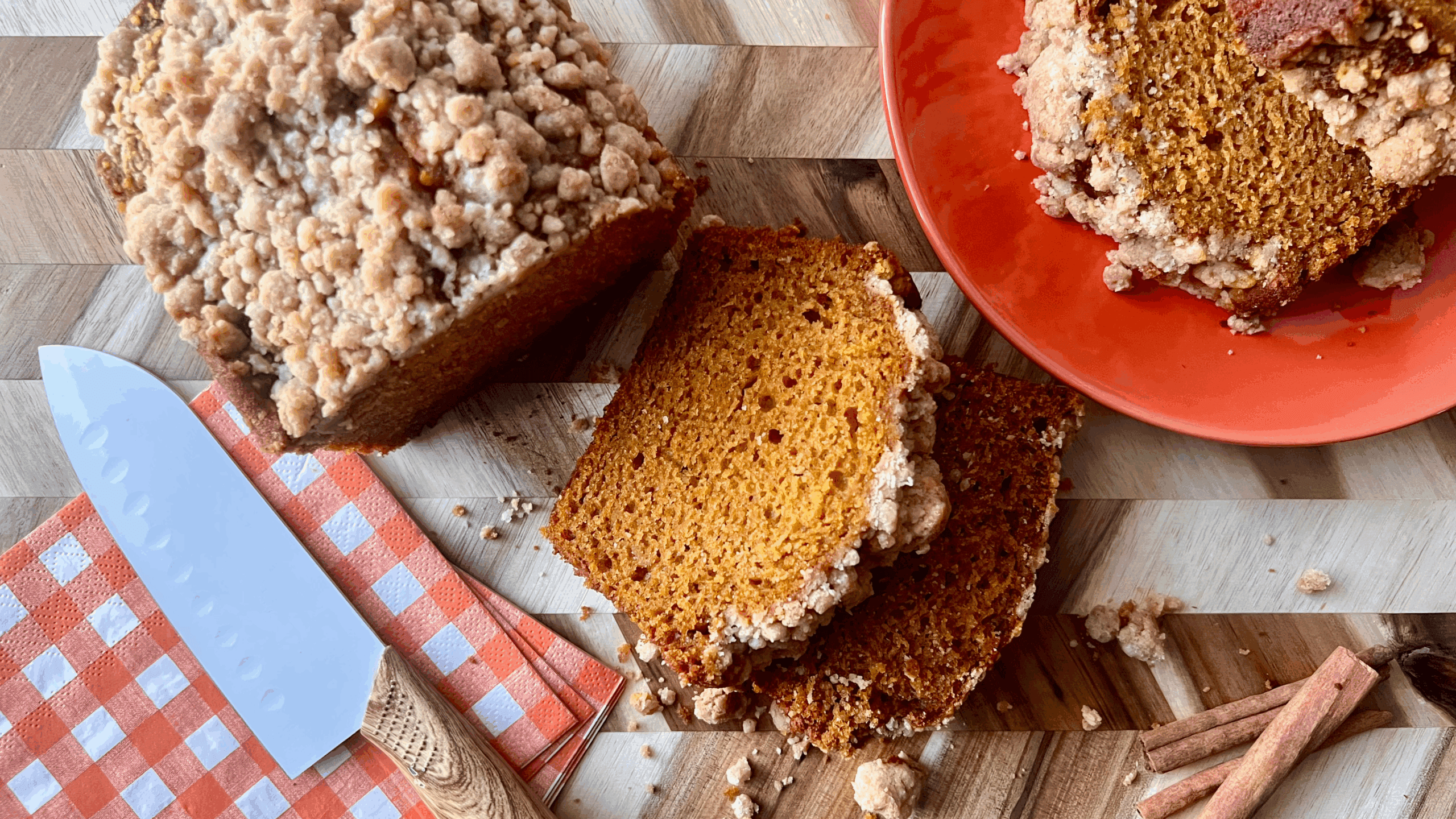 close-up shot of a slice of pumpkin bread with visible moist crumb and spices