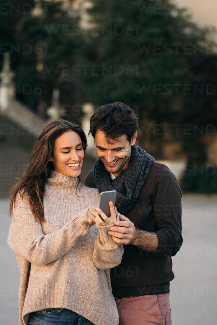 couple laughing and talking without phones present
